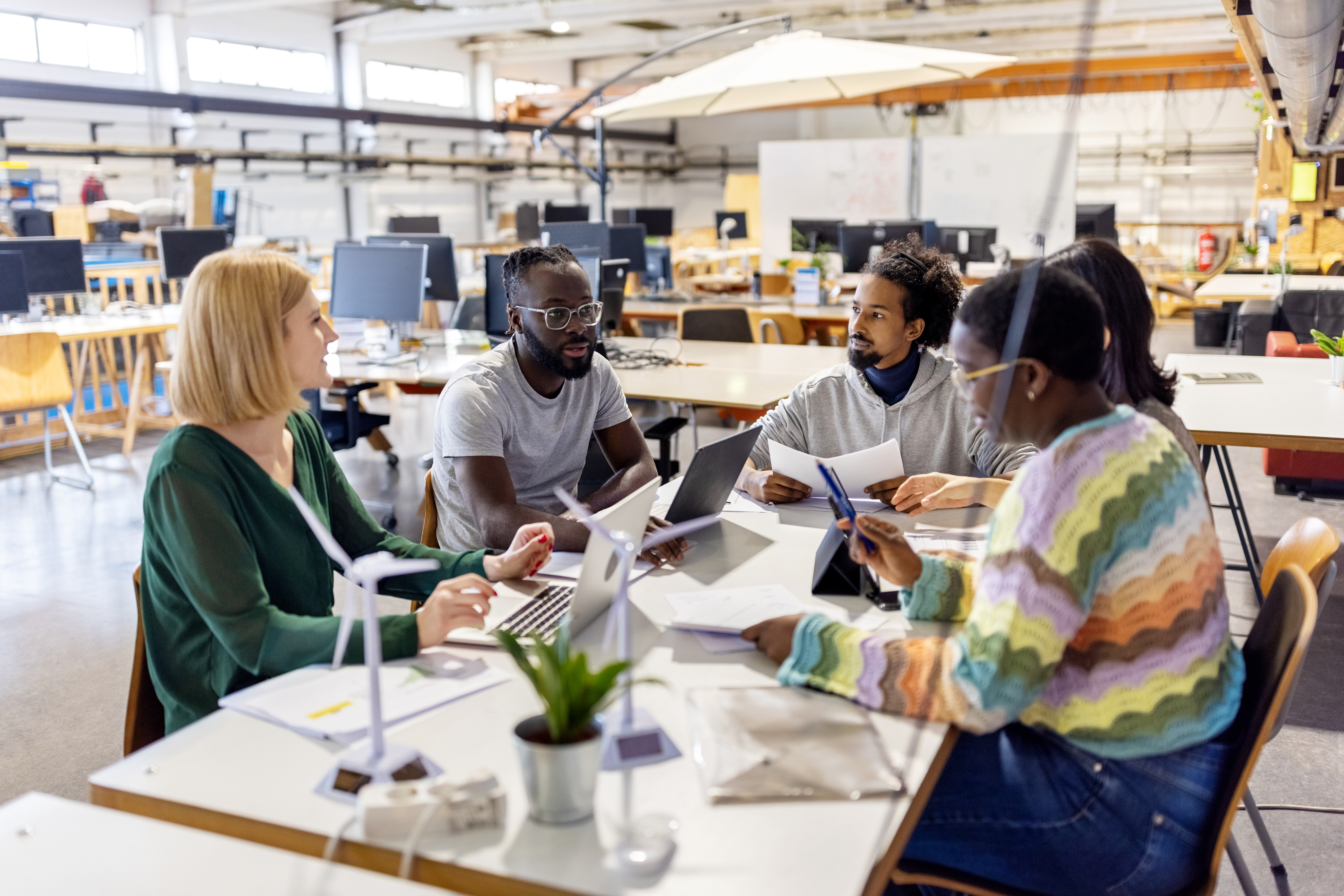 Team meeting in a bright shared office workspace